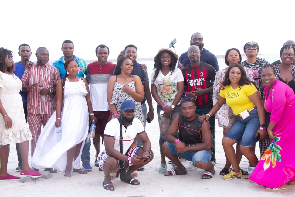 Classmates posing together by the water