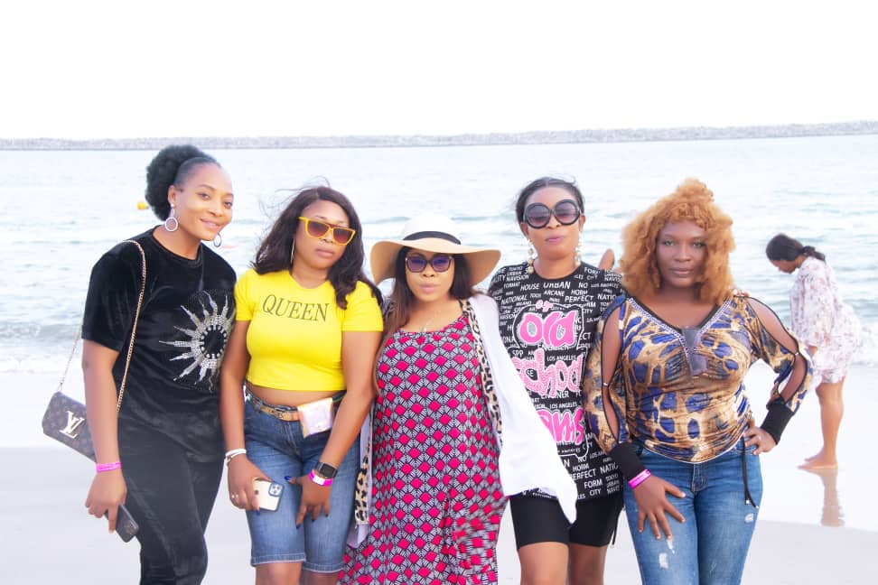 Classmates pictured together on the shoreline