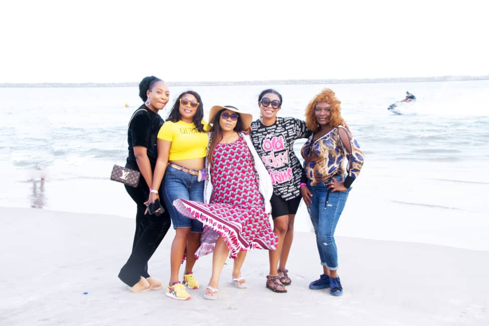 Classmates pictured together on the shoreline