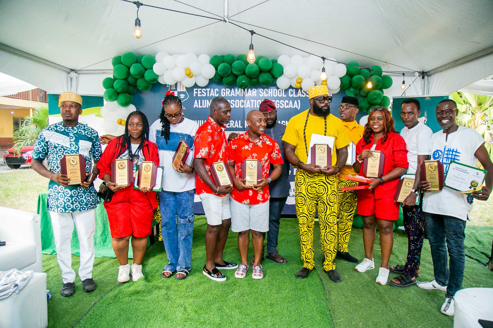 Group photograph with awards and certificates