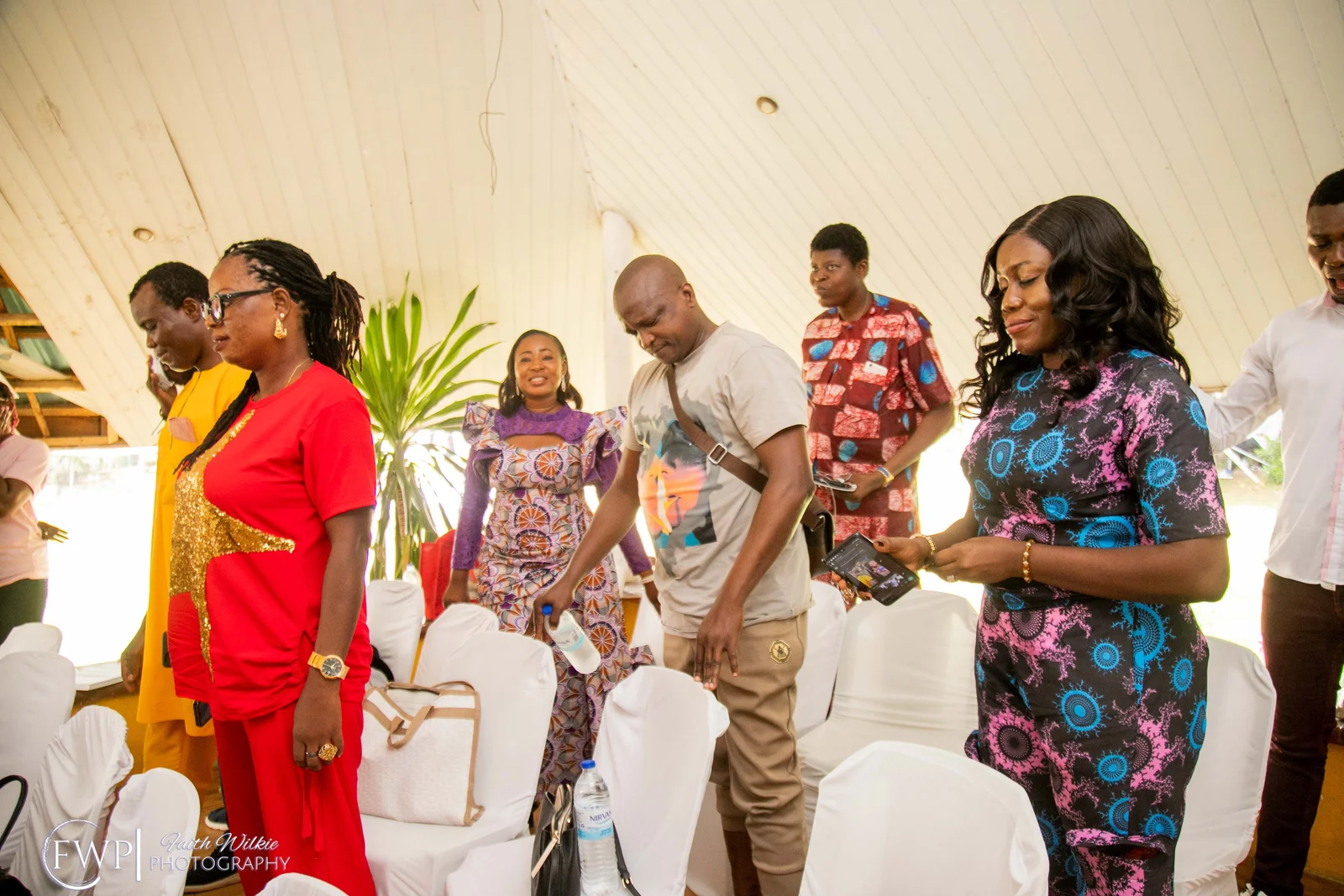 Members gathering under the canopy at the celebration (photograph 1 of 1)