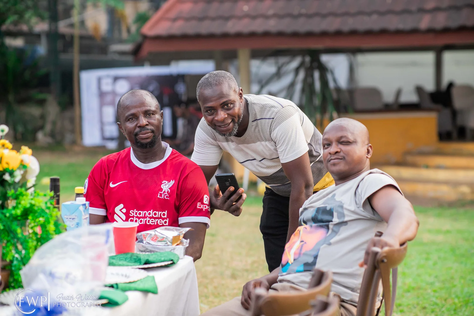 Members sharing table fellowship during the 2023 End-of-Year Party (photograph 4 of 5)