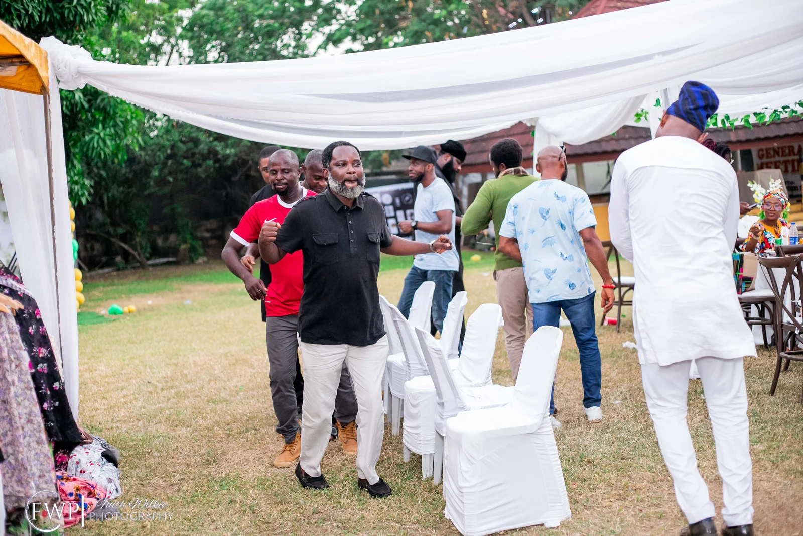Members taking part in a party game during the celebration (photograph 1 of 2)