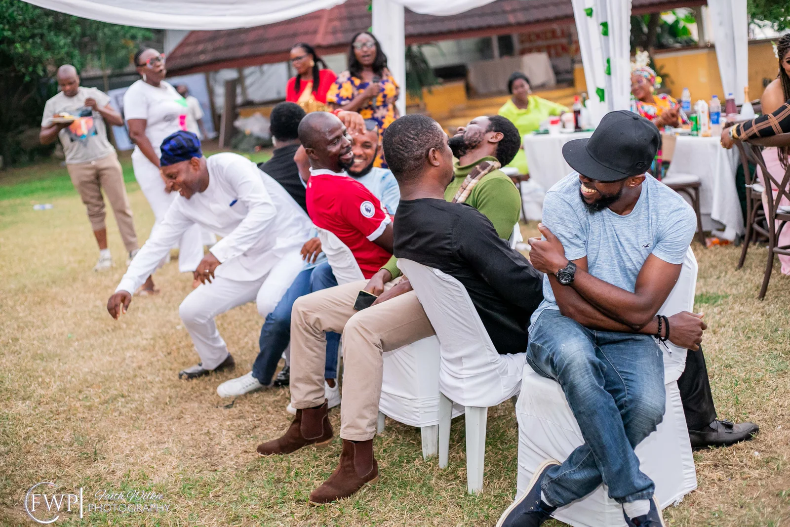 Members taking part in a party game during the celebration (photograph 2 of 2)