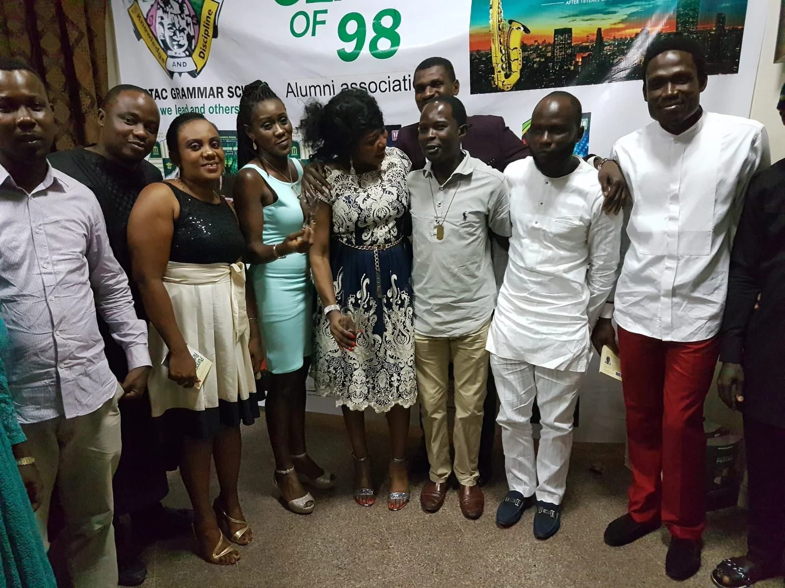 Members posing at the Class of 98 backdrop, 2016 (photograph 3 of 7)