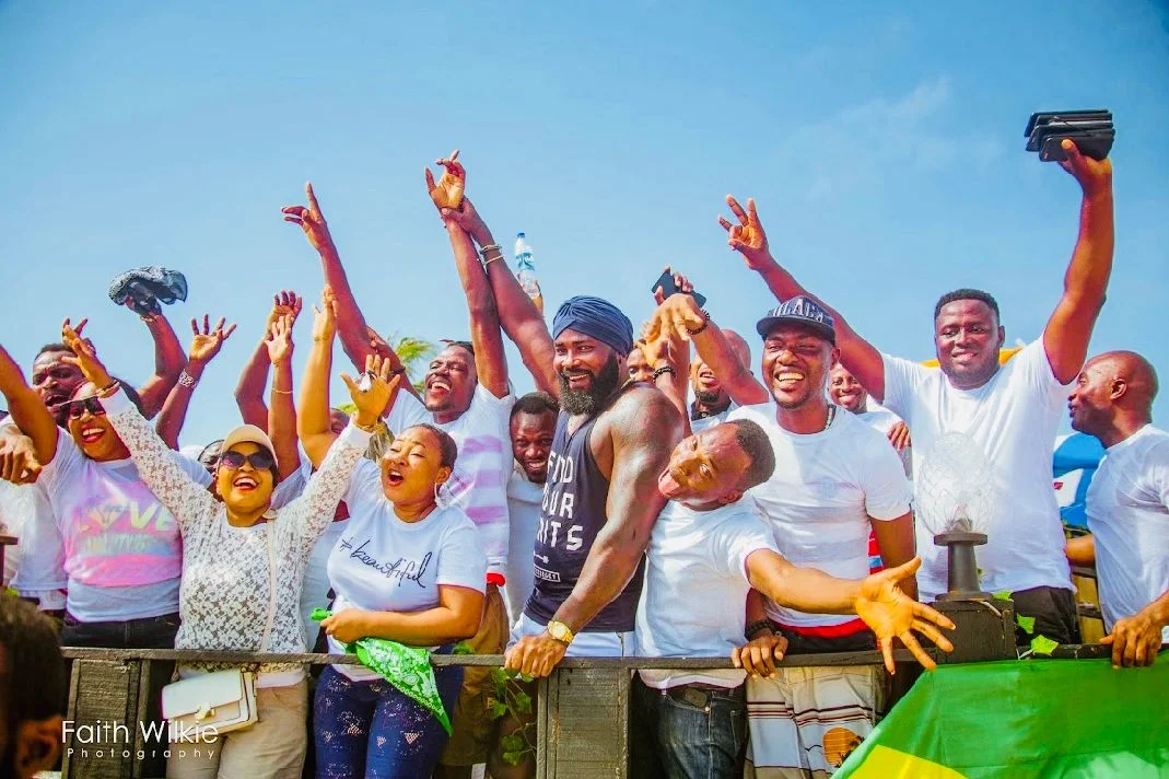 Members cheering at the railing during the Independence Day Beach Outing, 2019 (photograph 1 of 4)