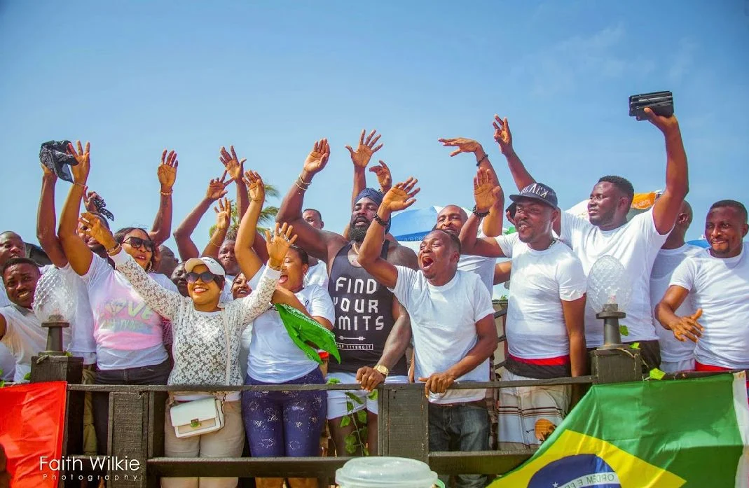 Members cheering at the railing during the Independence Day Beach Outing, 2019 (photograph 2 of 4)