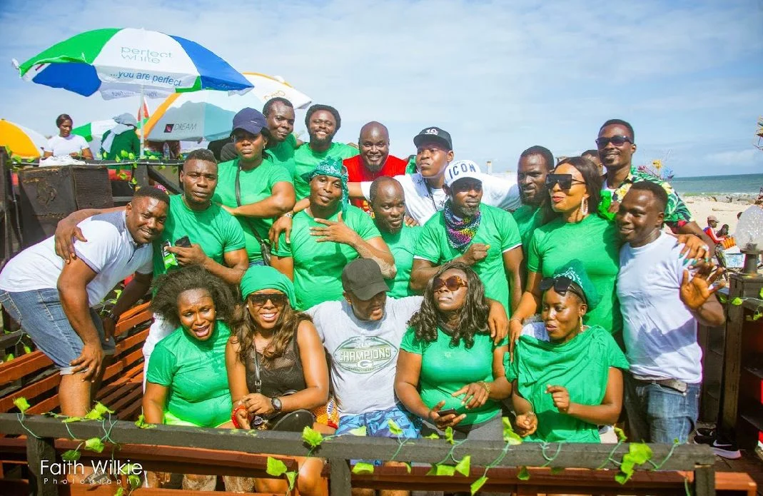 Members in green gathered for a group photograph at the Independence Day Beach Outing, 2019 (photograph 1 of 2)