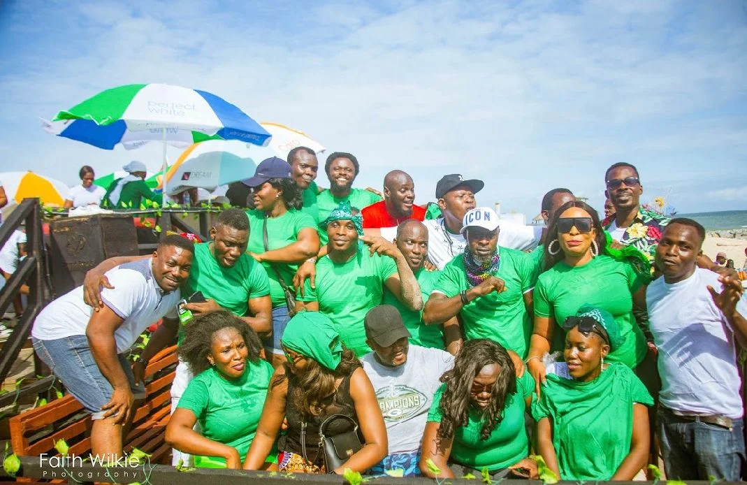 Members in green gathered for a group photograph at the Independence Day Beach Outing, 2019 (photograph 2 of 2)