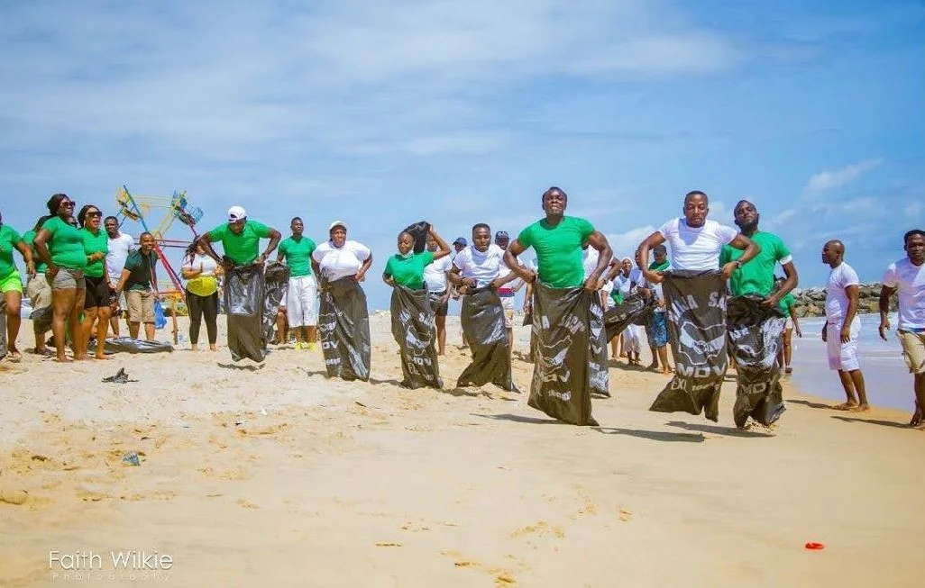 Members taking part in a sack race on the beach, 2019 (photograph 1 of 1)