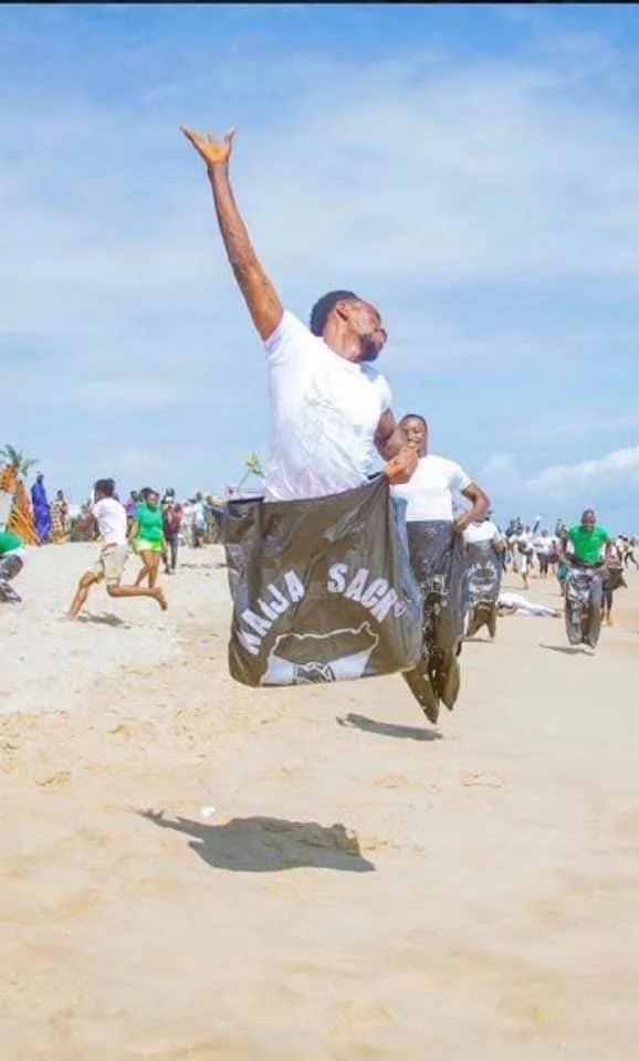 A member taking part in the sack race on the beach, 2019 (photograph 1 of 1)