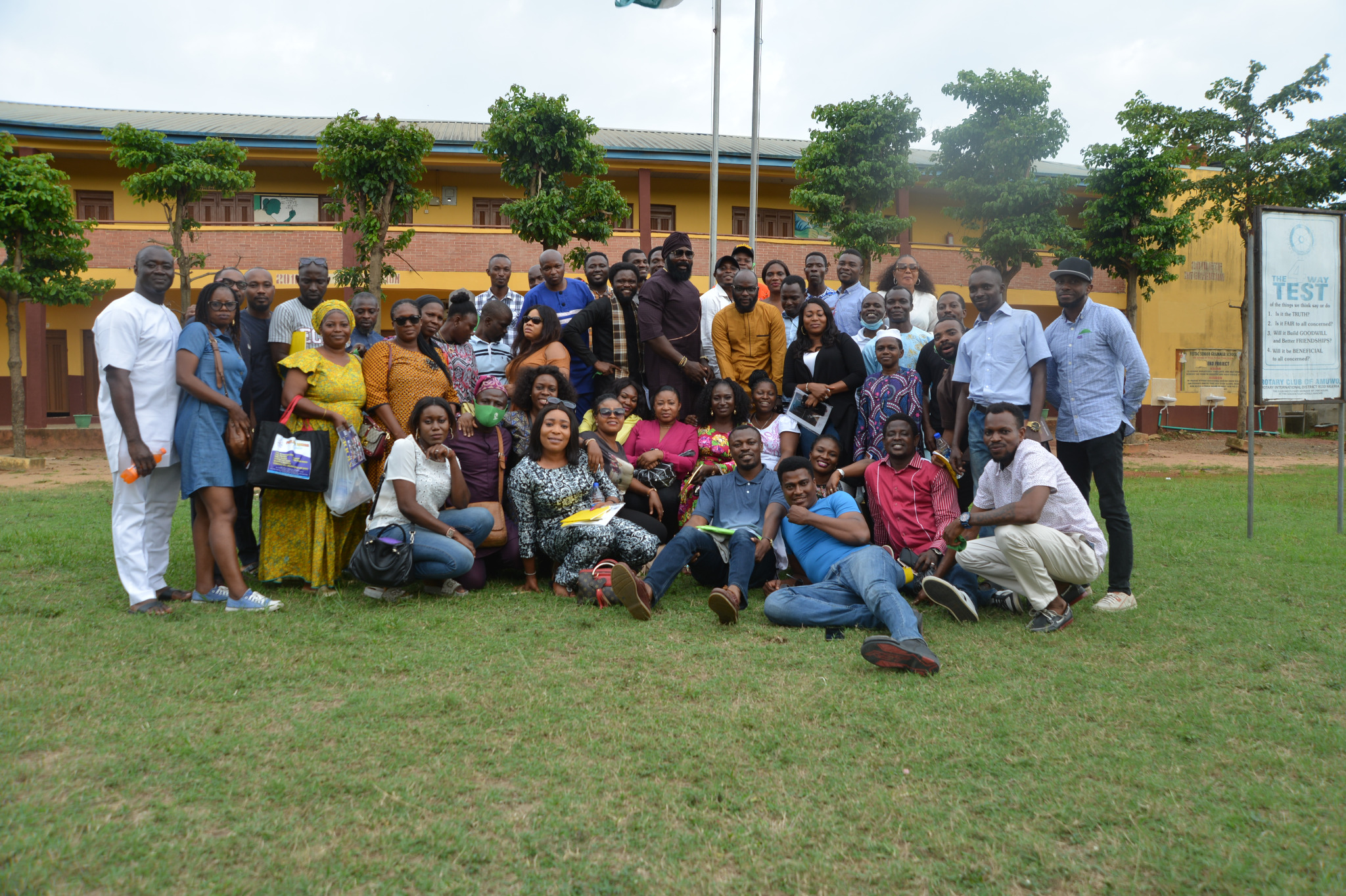 Classmates posing together on school grounds