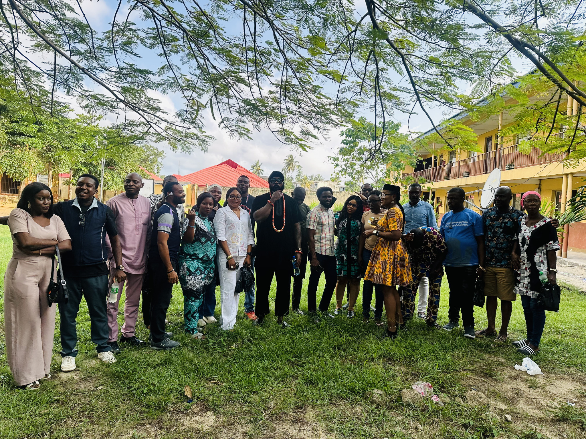 Group photograph in the school grounds beneath the trees