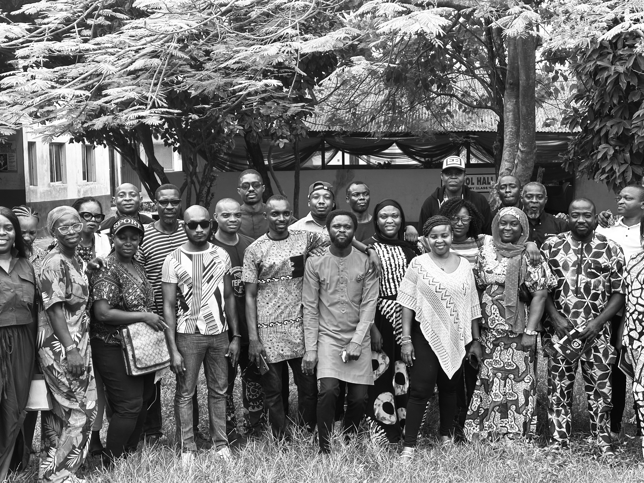 Black-and-white group portrait of alumni members