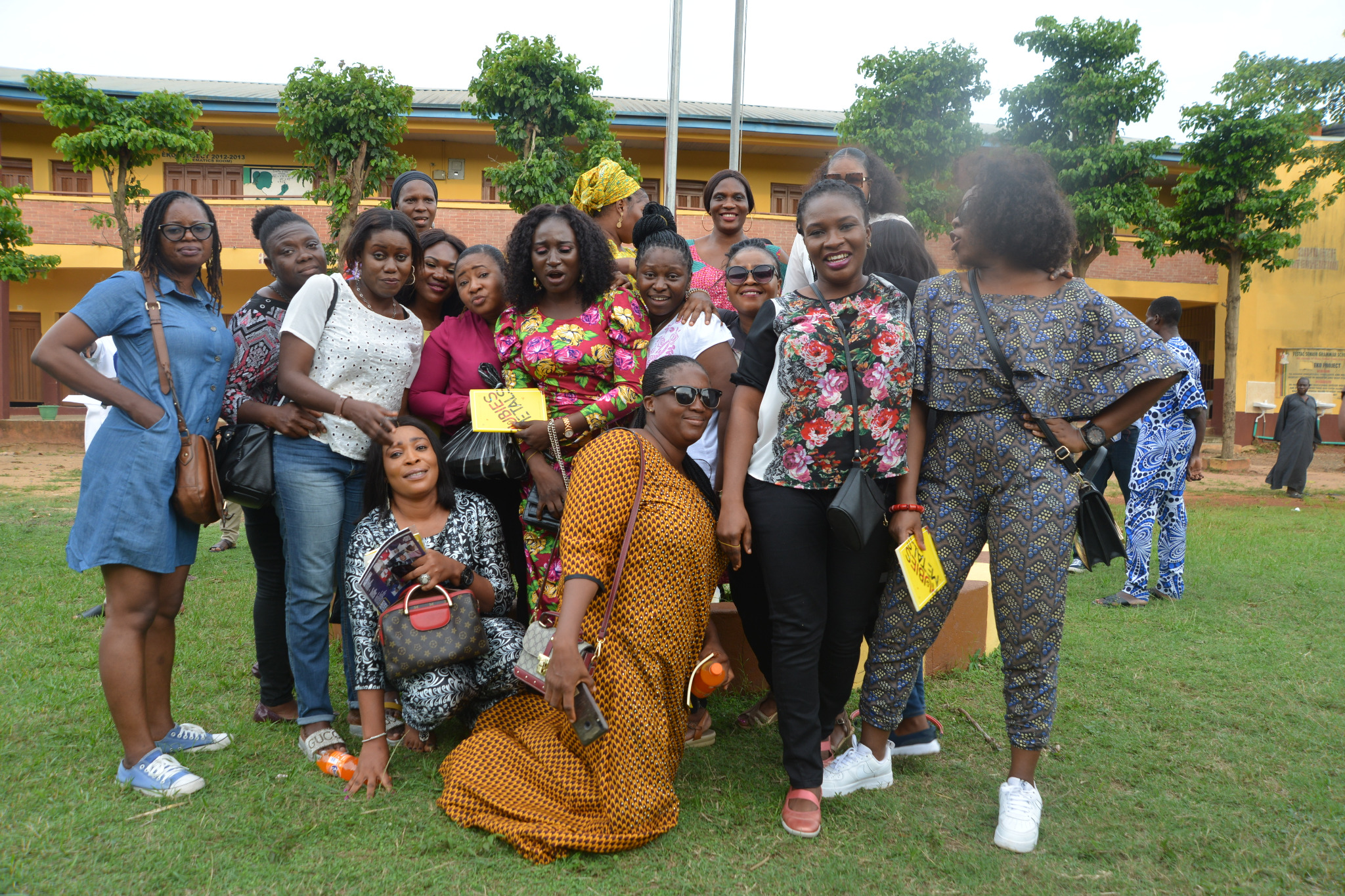 Alumni group portrait under the trees