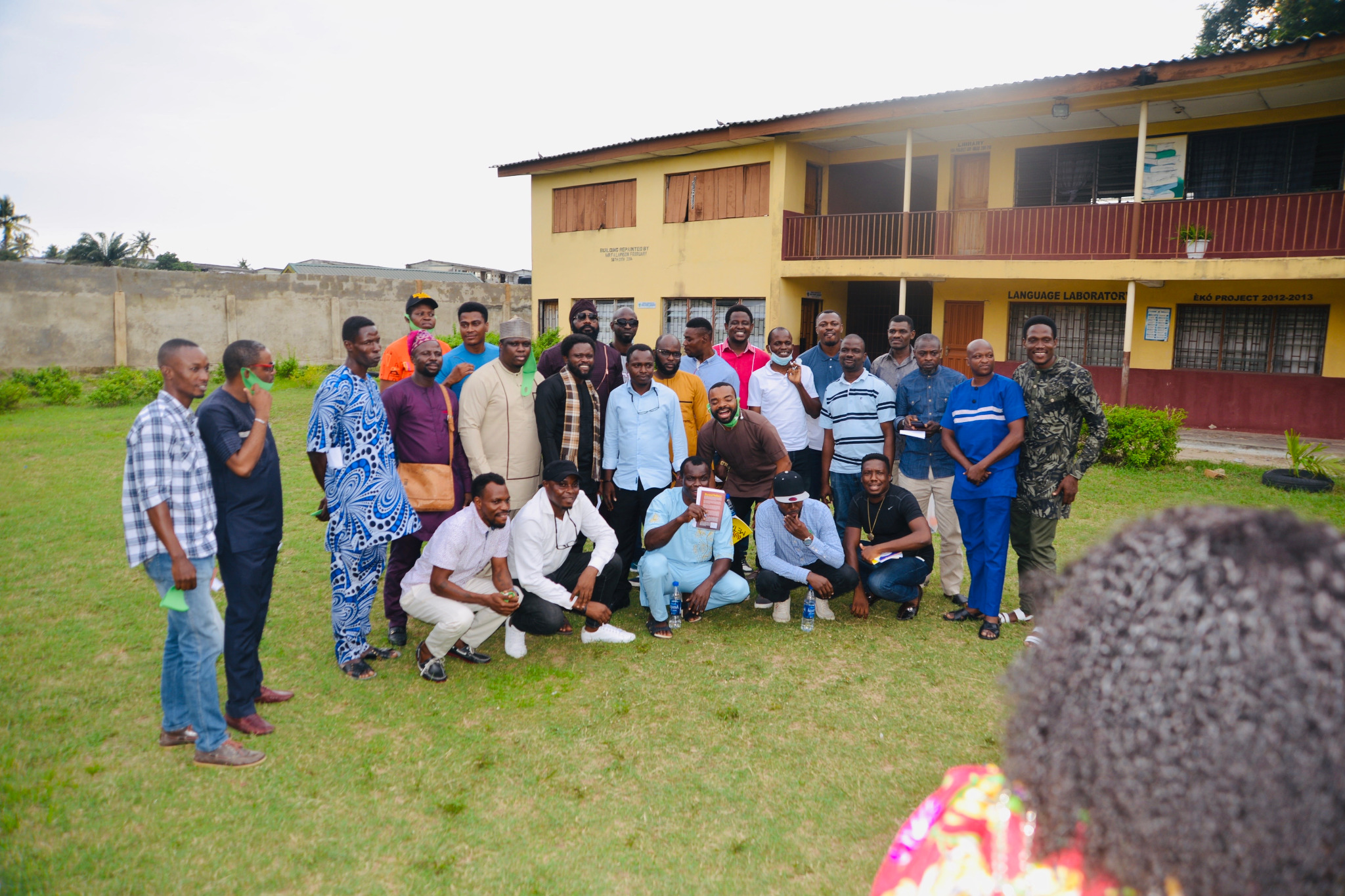 Alumni group portrait in the school courtyard