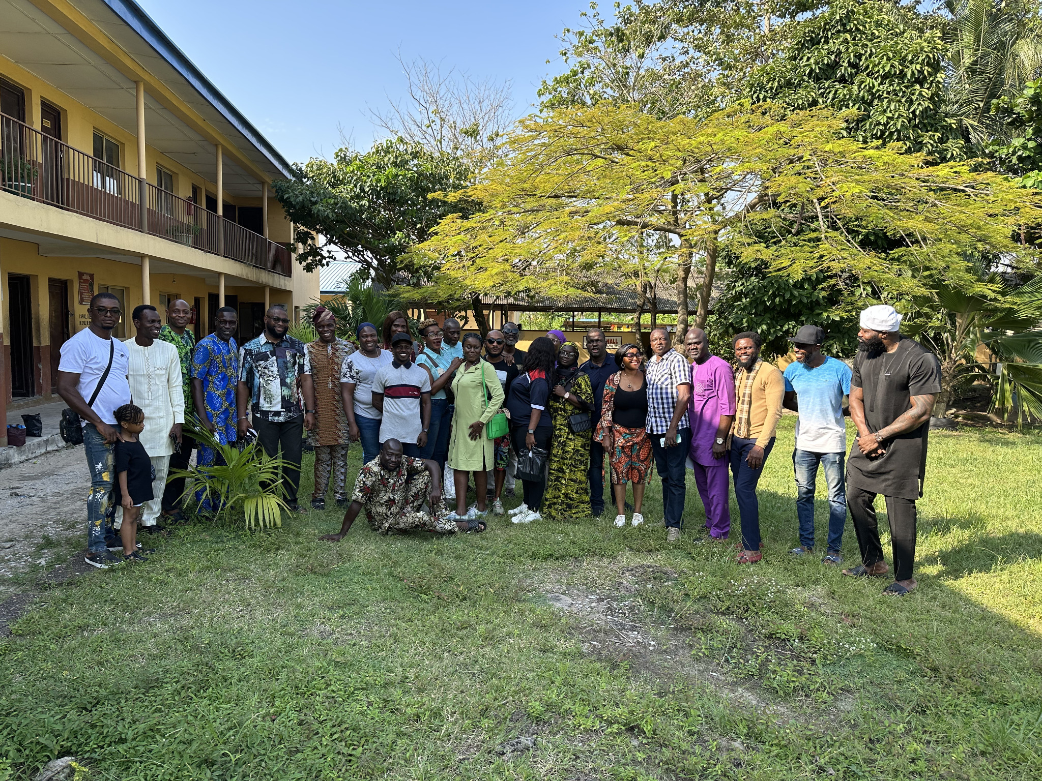 Alumni group portrait in the school courtyard