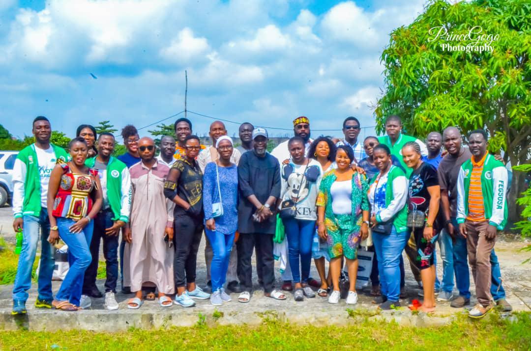 Alumni group photograph featuring association apparel