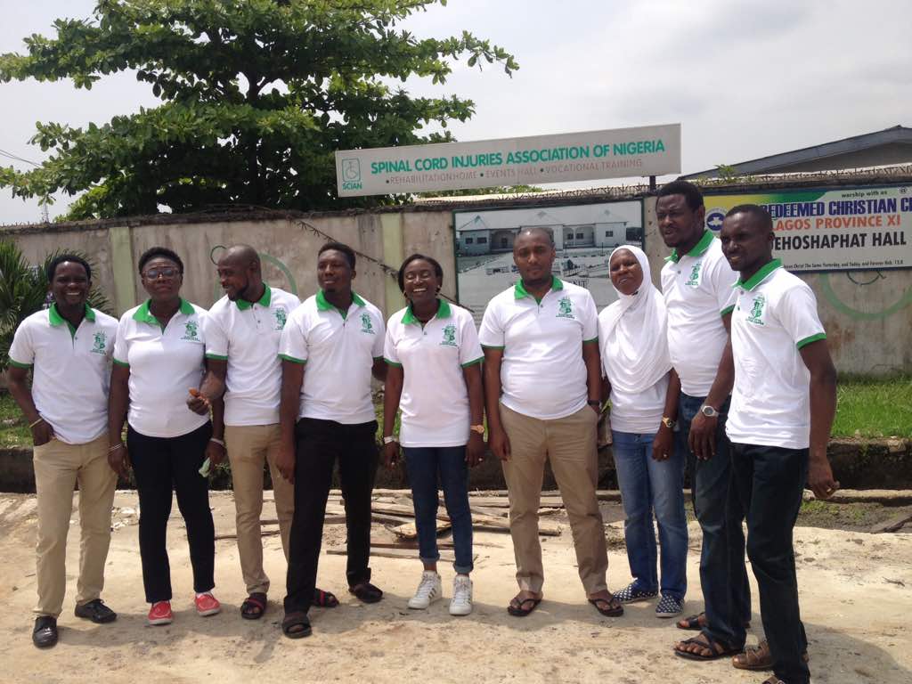 Alumni members photographed outside a community organisation