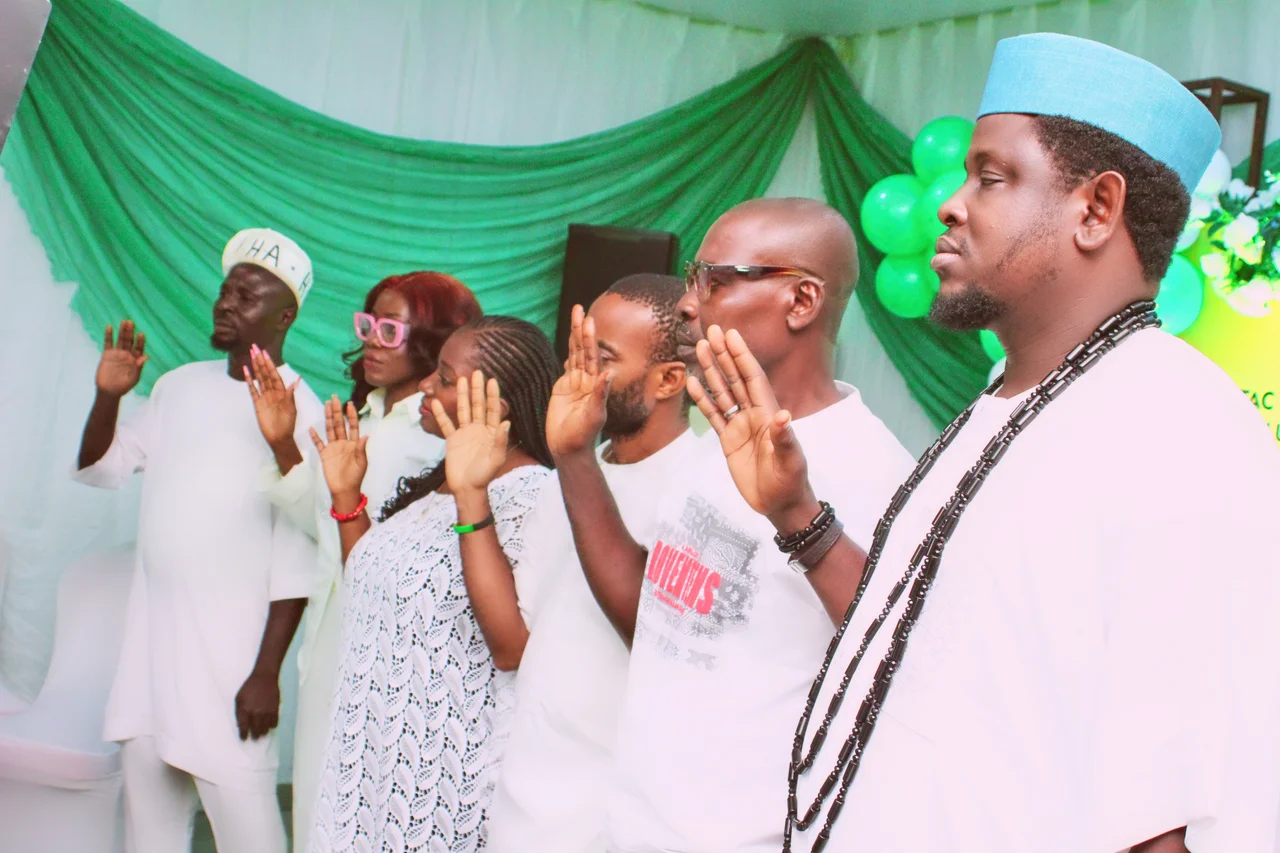 Members of the FGSCAA Executive Committee standing in a line with right hands raised, taking the oath of office in front of green and white drapes on 26 September 2026.