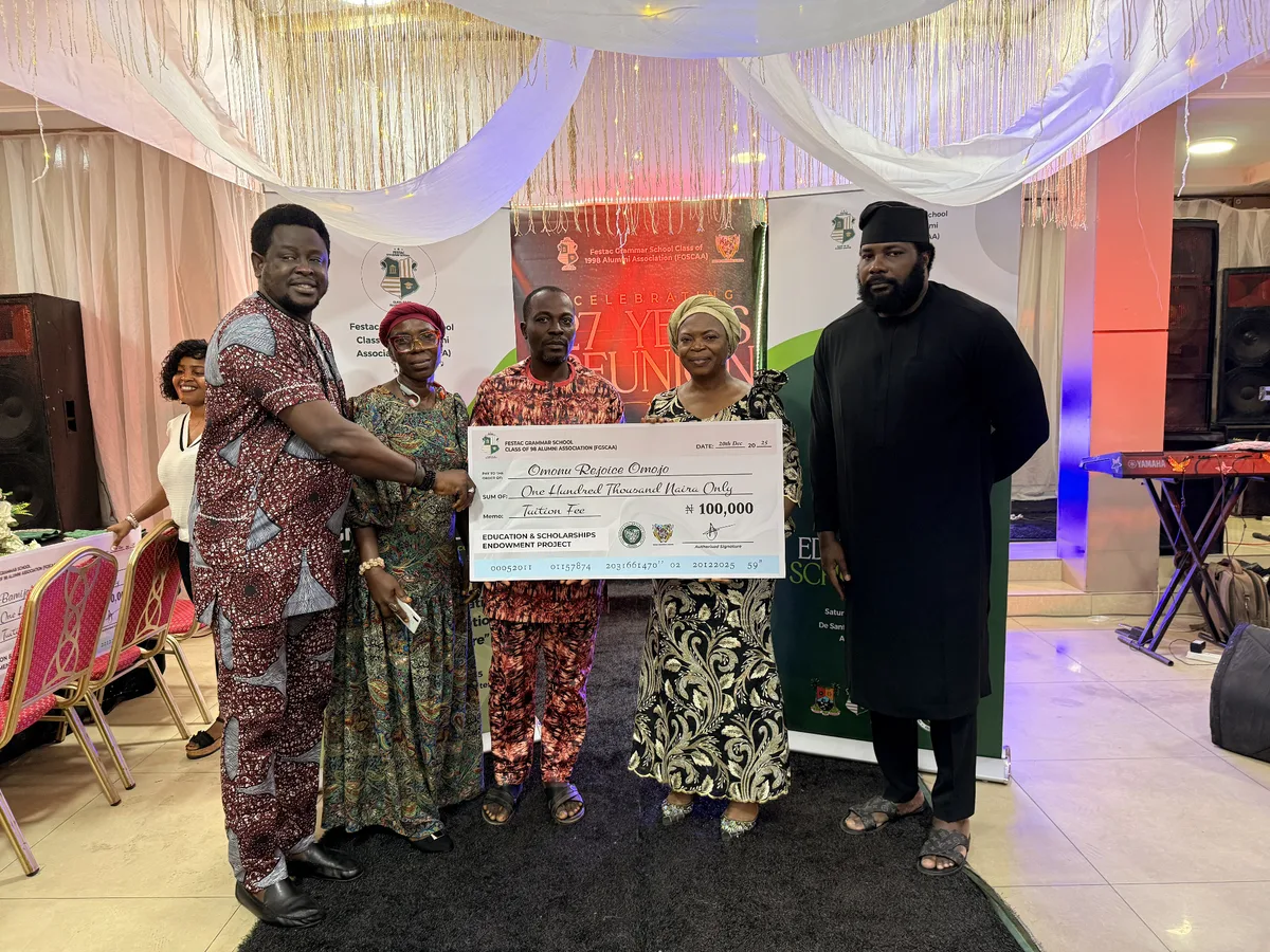 FGSCAA members presenting a ₦100,000 tuition-fee award cheque made out to scholarship beneficiary Omonu Rejoice Omojo.